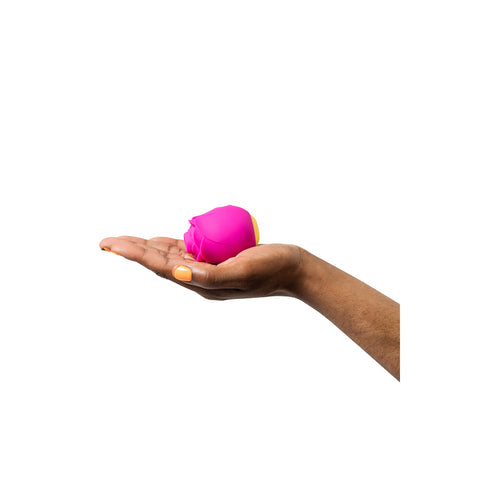 ROMP Rose clitoral stimulator shown in a hand for scale